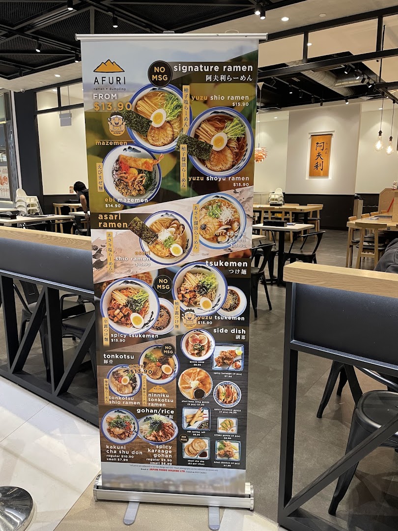 A large pull-up banner displaying Afuri's ramen and side dish menu with prices and photos.
