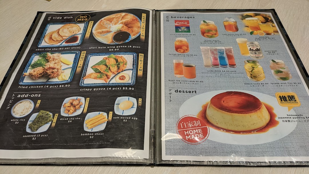 A detailed menu displaying side dishes, add-ons, beverages, and dessert options with prices.