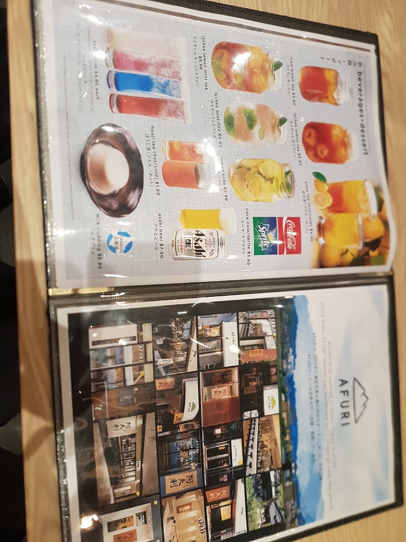 A menu page displaying Afuri's beverages and desserts, alongside a page detailing the brand's history.