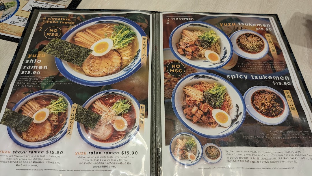A detailed menu displaying various ramen and tsukemen dishes with prices and descriptions.