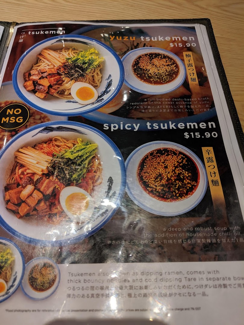 A close-up of Afuri's menu, showcasing their Yuzu Tsukemen and Spicy Tsukemen dishes with descriptions and prices.