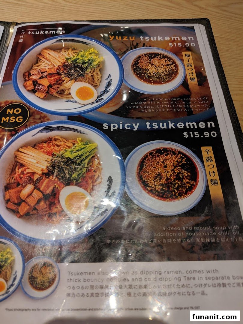 A close-up of Afuri's menu, showcasing their Yuzu Tsukemen and Spicy Tsukemen dishes with descriptions and prices.