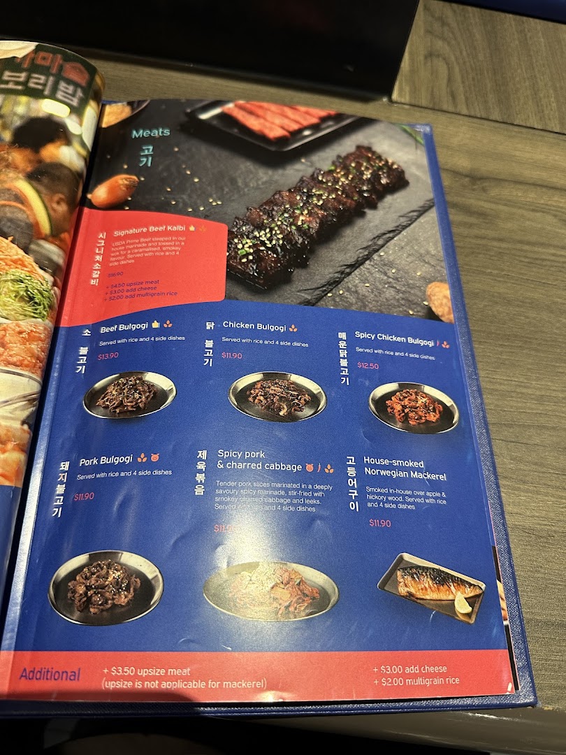 A menu page from Ajummas showcasing Korean meat and fish dishes with descriptions and prices.