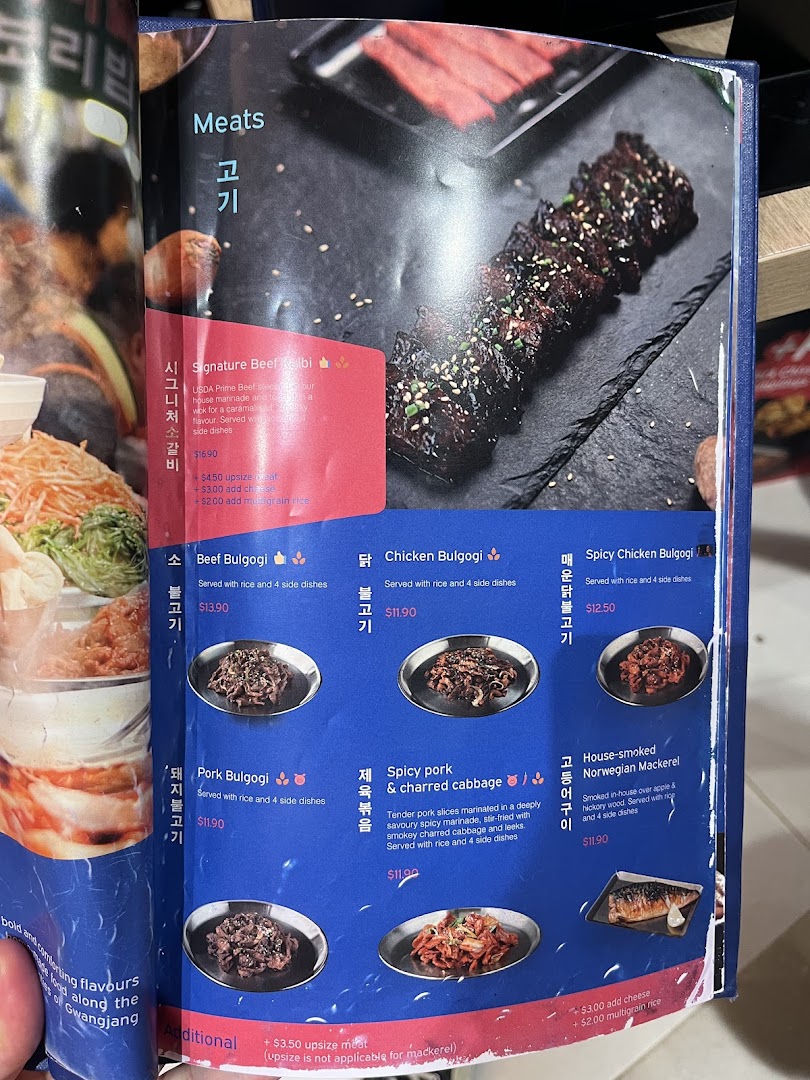 A page from Ajummas' menu showcasing various Korean meat dishes and their prices.