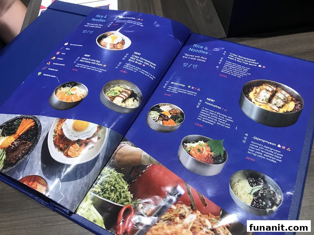A vibrant menu from Ajummas, showcasing various Korean rice and noodle dishes with enticing photos.