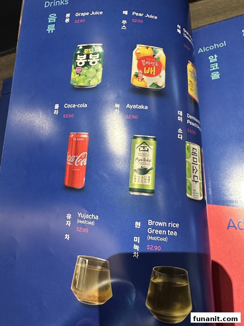 A close-up view of a drinks menu featuring various beverages and their prices.