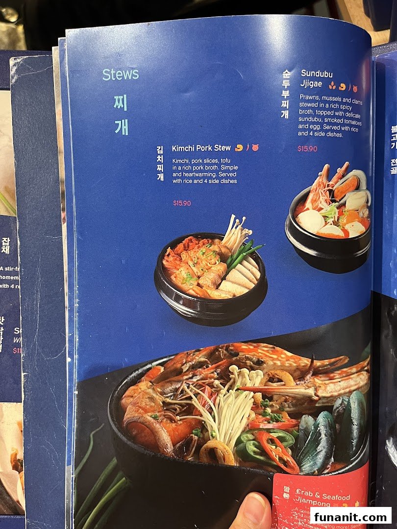 A page from Ajummas' menu featuring various Korean stews with descriptions and prices.