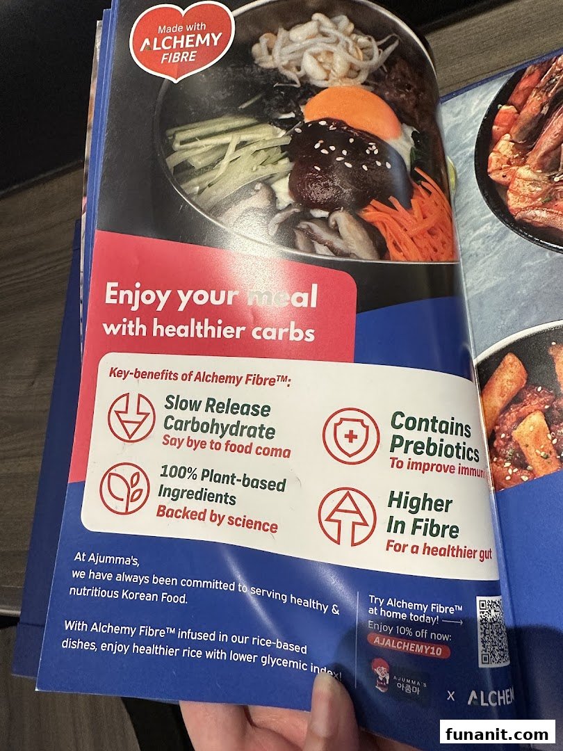 A promotional page for Ajumma's, highlighting a Korean dish and the health benefits of Alchemy Fibre.