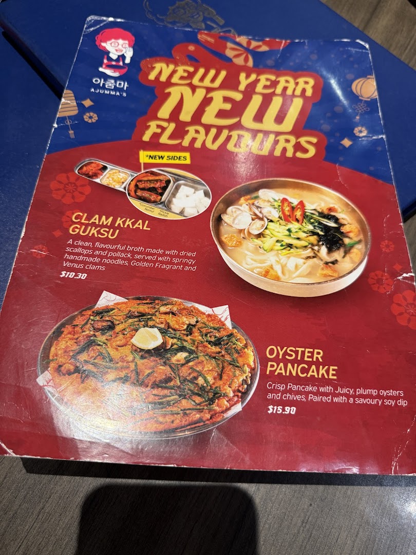 A menu page from Ajummas featuring New Year New Flavours specials like Clam Kkal Guksu and Oyster Pancake.
