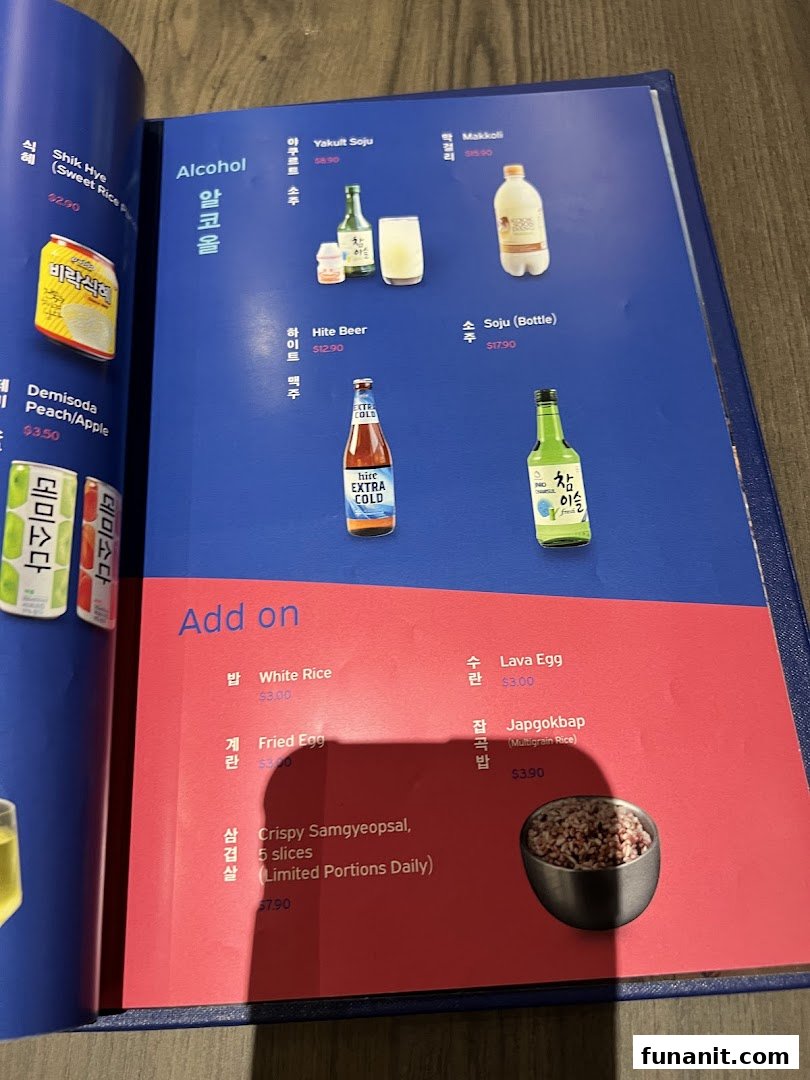A detailed view of a menu page featuring Korean alcoholic beverages and add-on dishes.