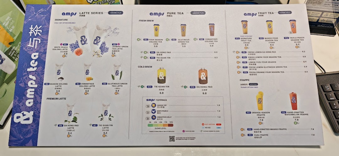 A detailed menu from Amps Tea, showcasing a variety of latte, pure tea, fruit tea, and frappe options.