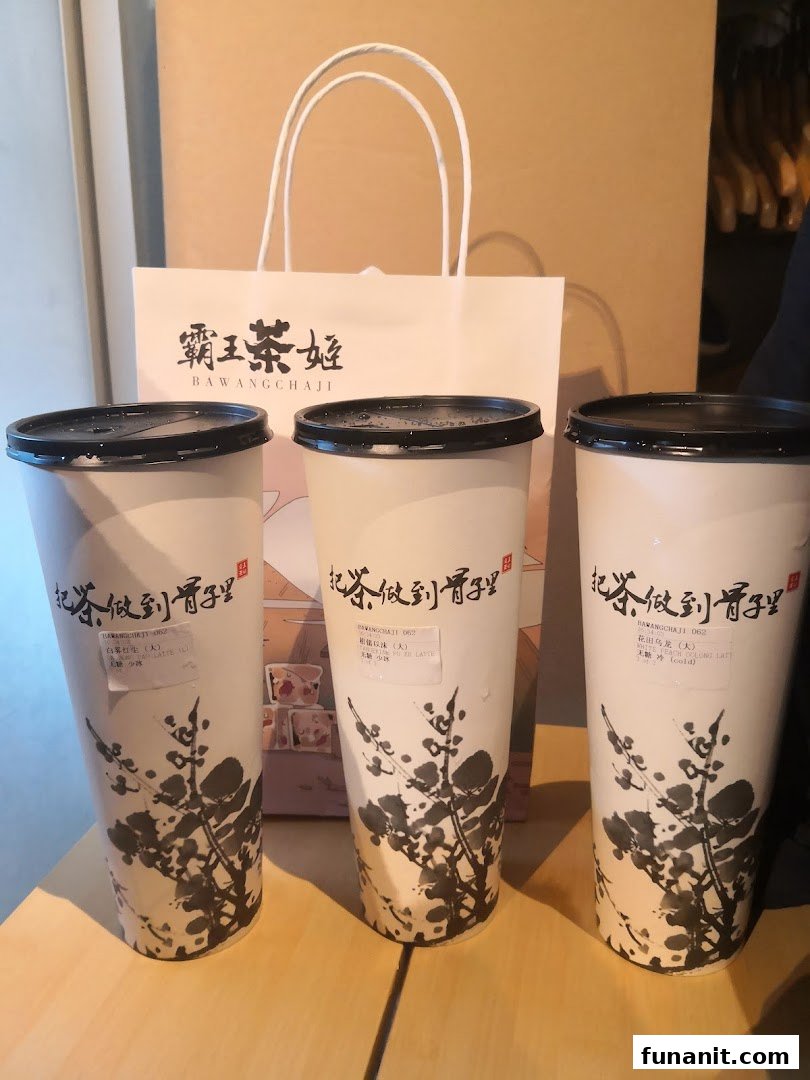 Three beautifully designed tea cups and a branded paper bag from Bawangchaji.