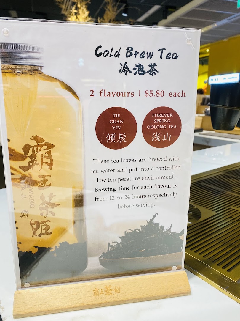 A display stand showcasing cold brew tea options, pricing, and brewing details.