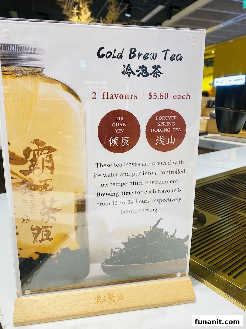 A display stand showcasing cold brew tea options, pricing, and brewing details.