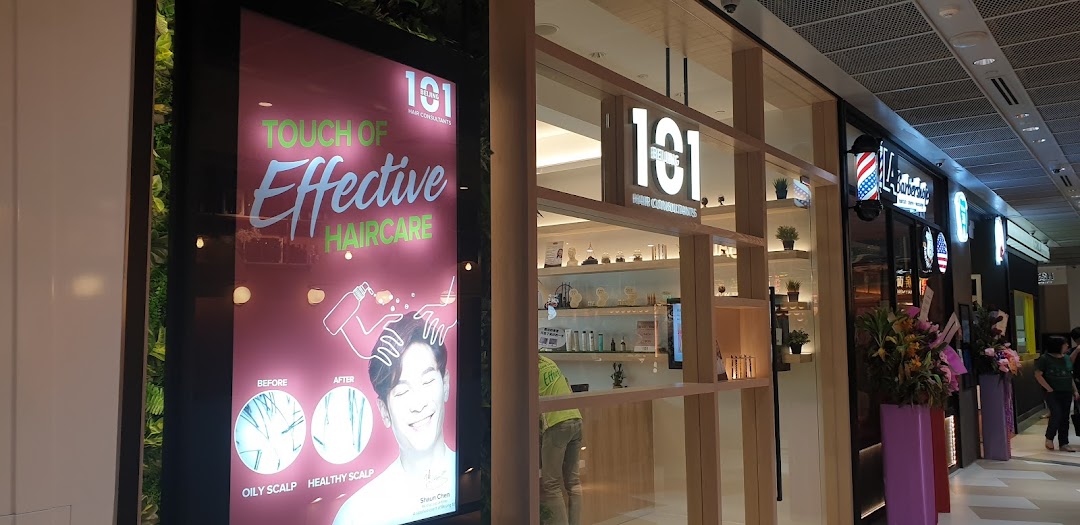 The brightly lit shop front of Beijing 101 Hair Consultants, featuring promotional signage.