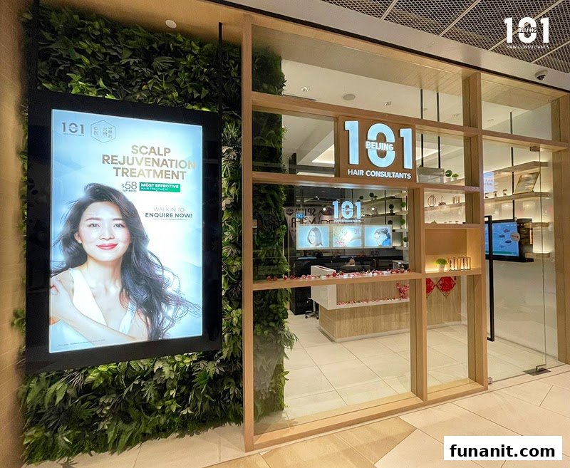 The shopfront of Beijing 101 Hair Consultants, featuring a green wall and a promotional display.