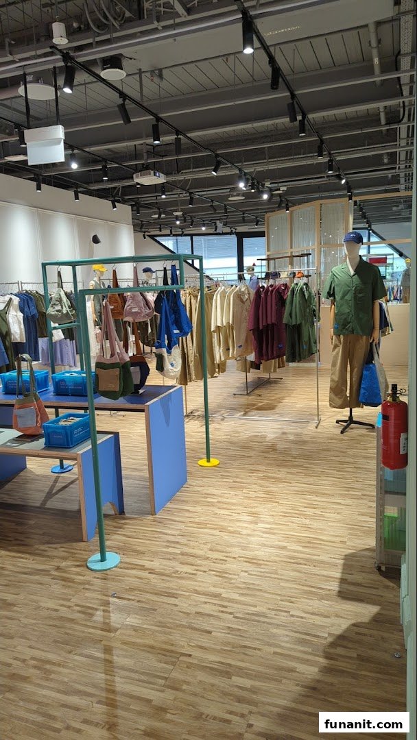 Interior view of Beyond The Vines Design Store, showcasing a wide range of apparel and accessories on display.