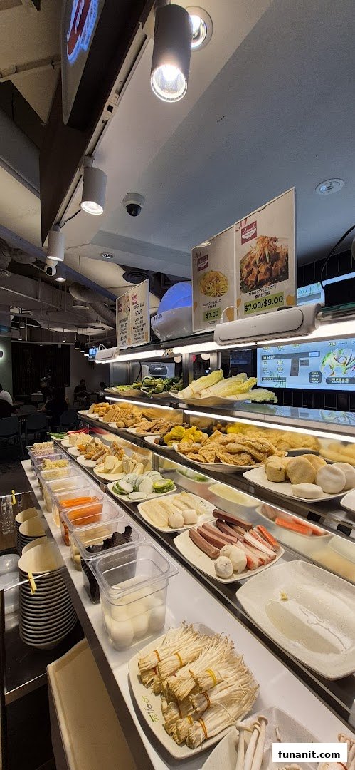 A vibrant display of fresh ingredients and prepared items on a food counter, ready for selection at Big Appetite.