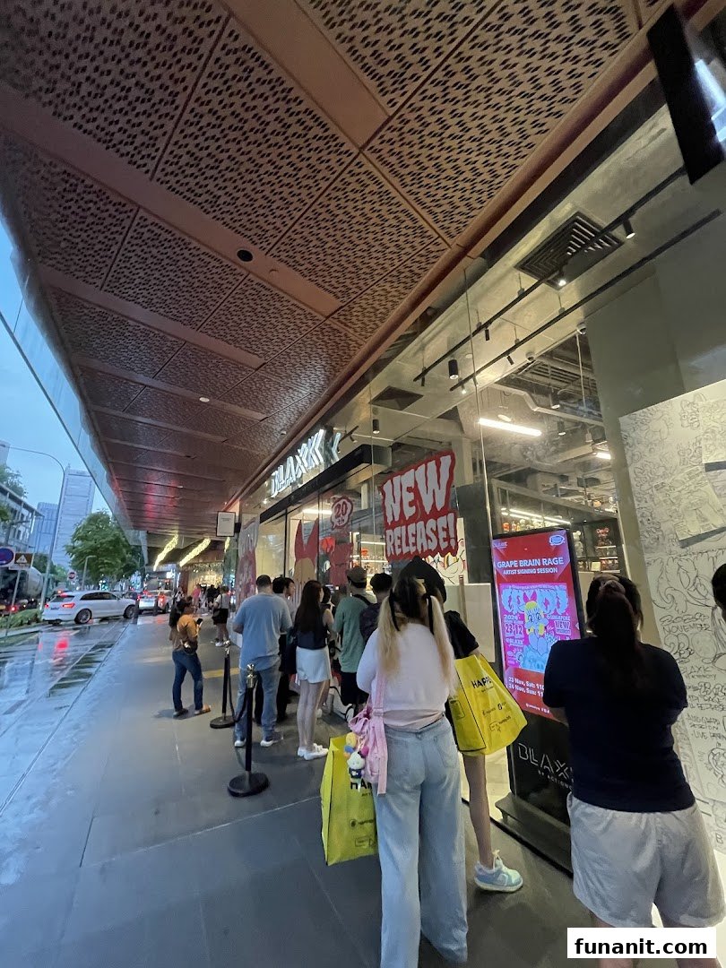 Customers queue outside BLAXK by ActionCity, featuring 'New Release' and 'Grape Brain Rage' event signage.