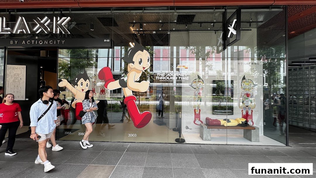 The storefront of BLAXK by ActionCity featuring large Astro Boy graphics and window displays.