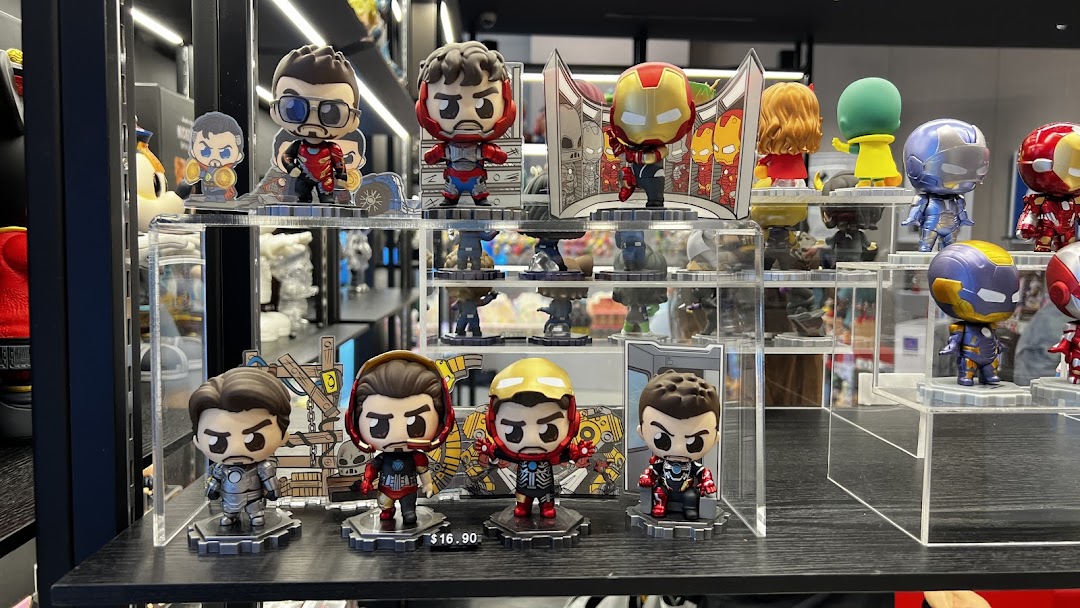 A vibrant display of collectible Iron Man and other superhero figures on clear acrylic stands.