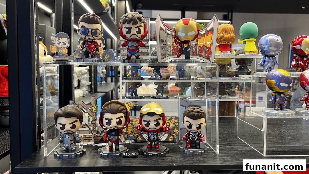 A vibrant display of collectible Iron Man and other superhero figures on clear acrylic stands.