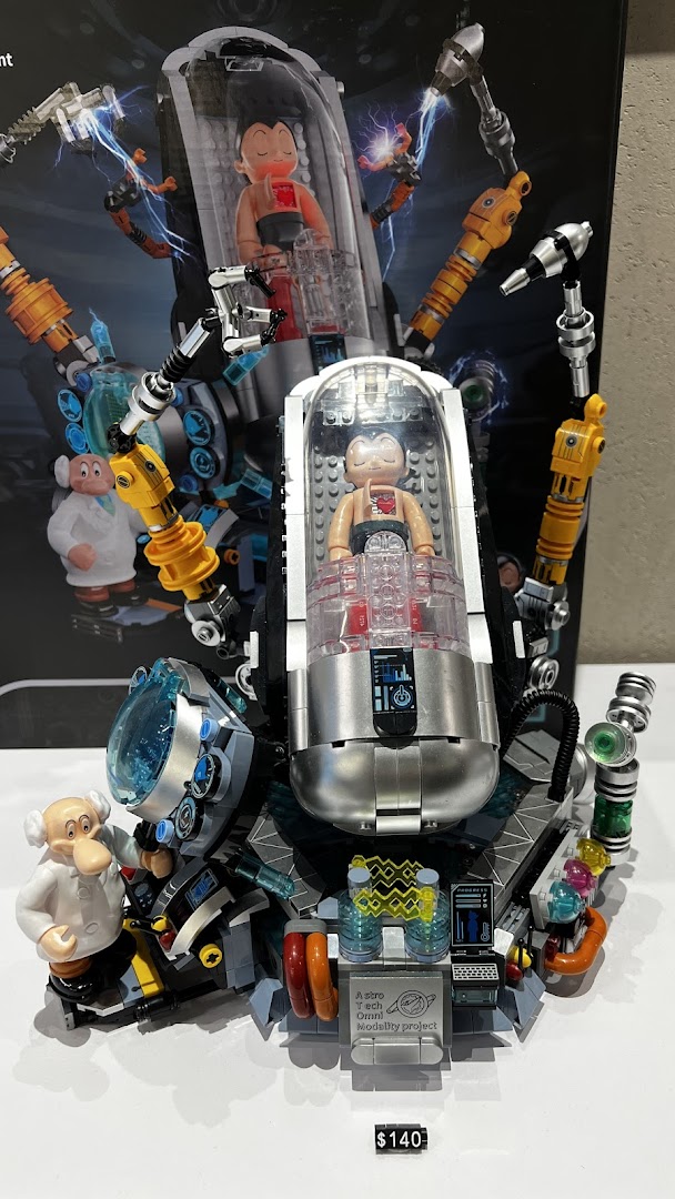 A detailed Astro Boy collectible figure in a futuristic lab setup, displayed for sale.