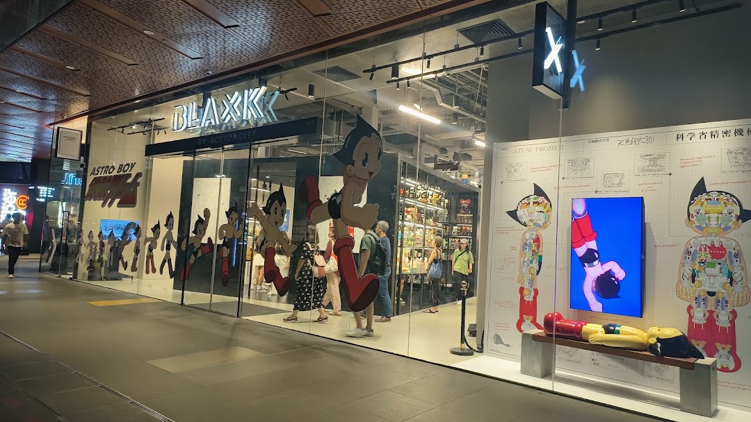 The shop front of BLAXK by ActionCity, featuring large Astro Boy graphics and collectibles.