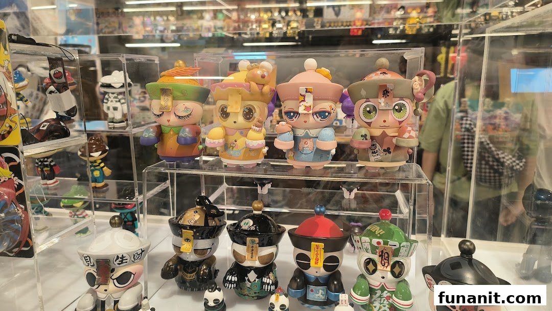 A vibrant display of unique, colorful designer art toys and collectible figurines in a retail shop.