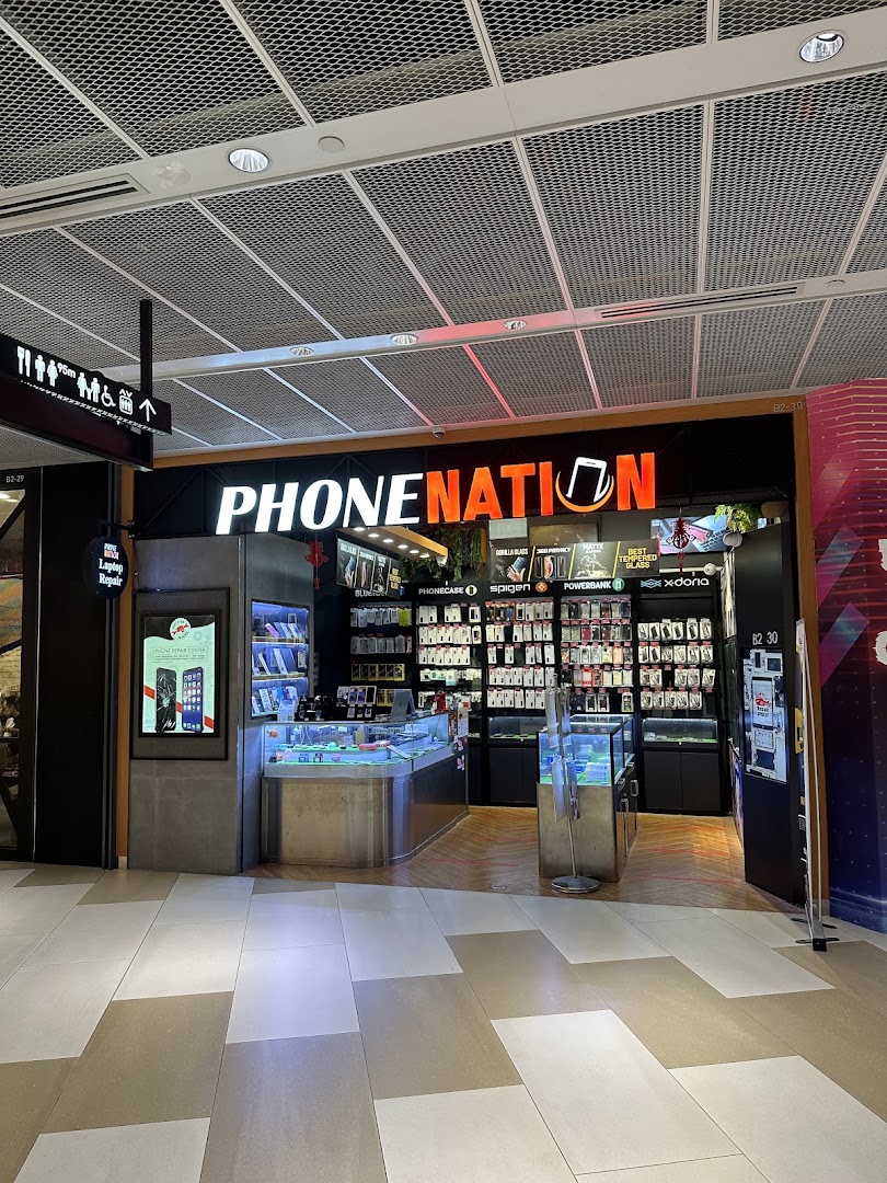 The image shows the brightly lit storefront of PHONENATION, a mobile phone and accessories shop.