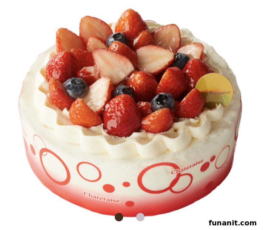 A vibrant Châteraisé cake adorned with fresh strawberries and blueberries, topped with cream.
