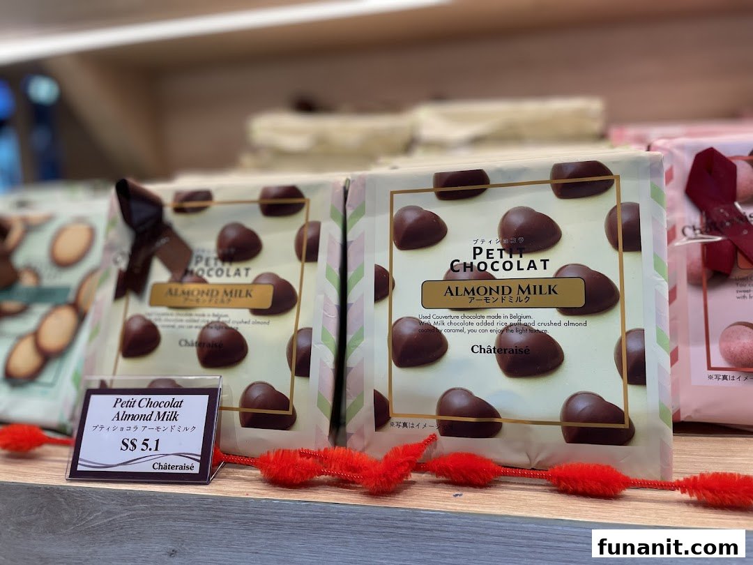 Close-up of Châteraisé's Petit Chocolat Almond Milk packages displayed on a shelf with a price tag.