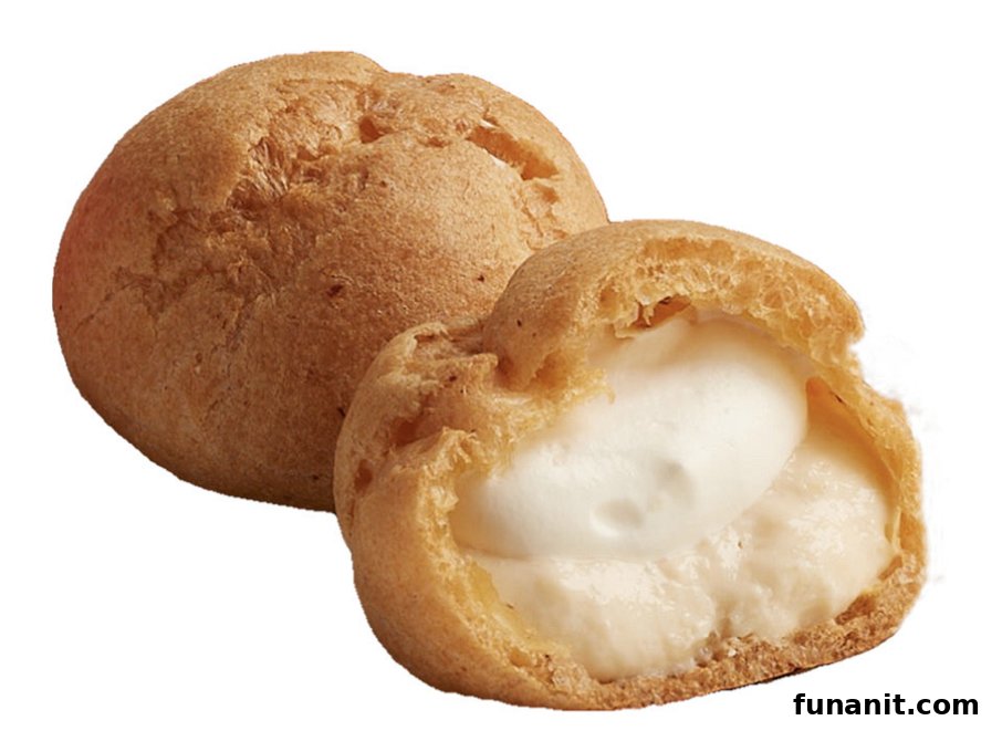 Two golden cream puffs, one whole and one cut open revealing creamy white filling.