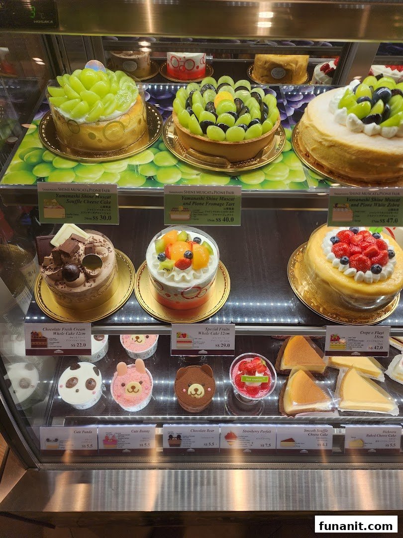A vibrant display case showcasing a variety of exquisite cakes and delightful desserts at Châteraisé.