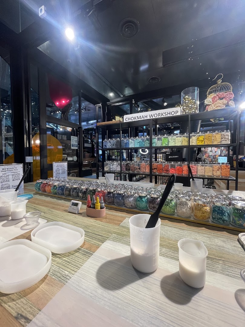An interior shot of Chokmah Workshop, featuring a table set up for crafting with colorful materials.