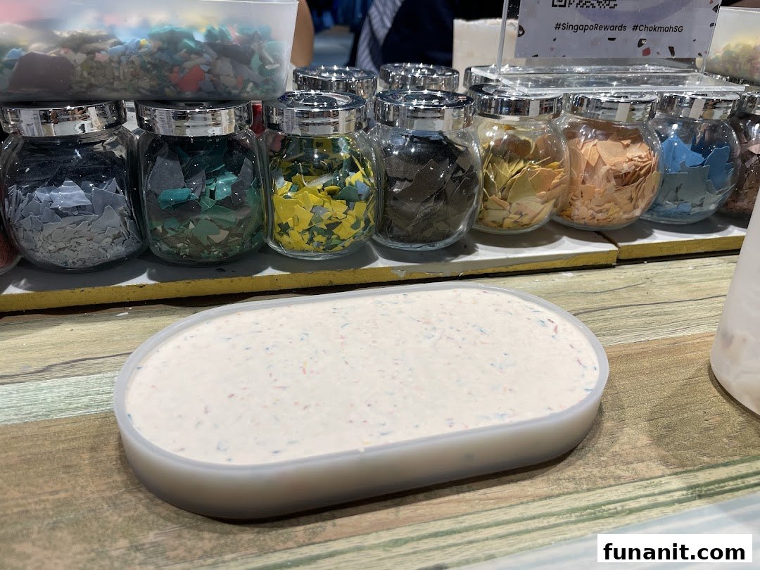 Jars of colorful flakes and a tray of white material, likely for custom product creation at Chokmah.