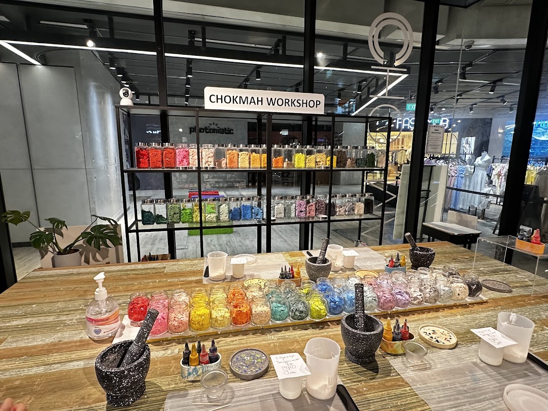 Chokmah workshop table with colorful craft materials, mortars, and pestles, ready for creative activities.