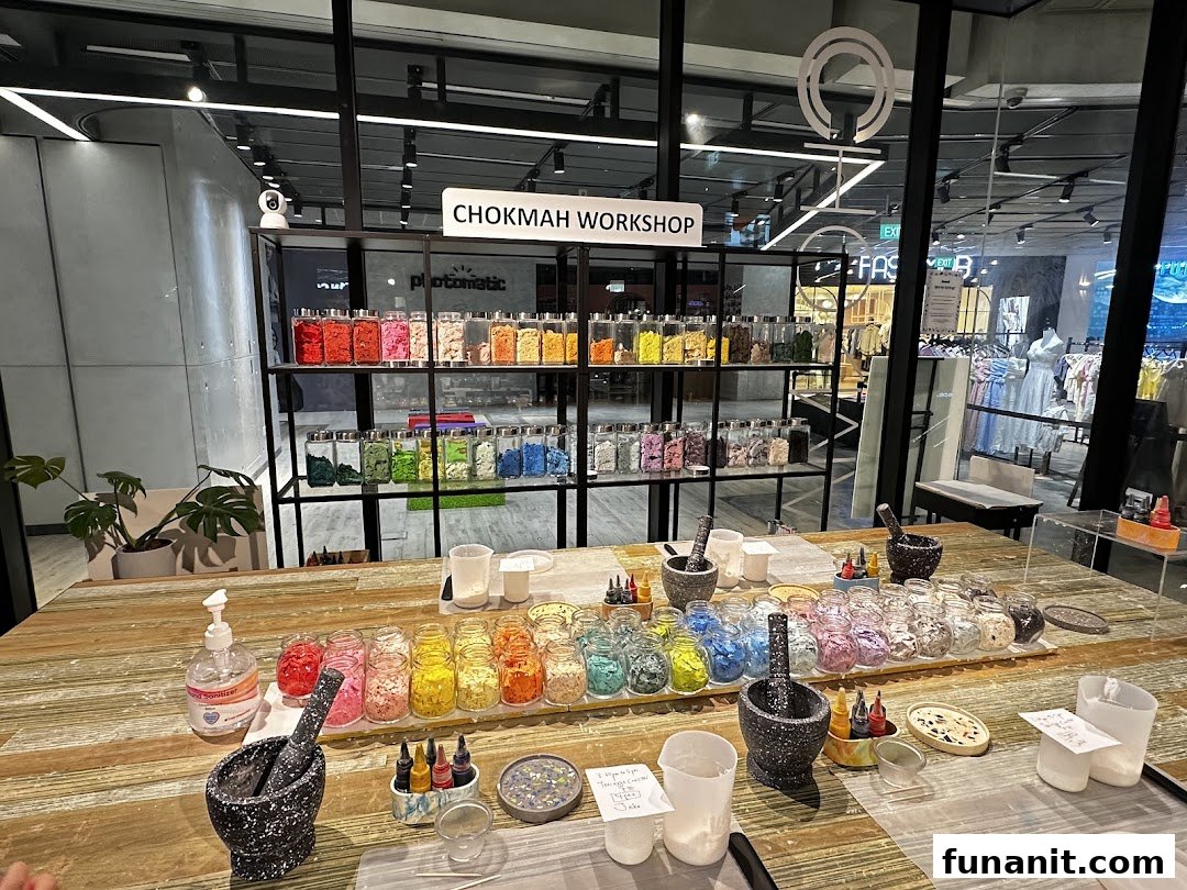 Chokmah workshop table with colorful craft materials, mortars, and pestles, ready for creative activities.
