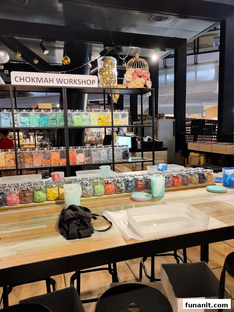 A vibrant Chokmah workshop area featuring colorful materials in jars and a large table for creative activities.