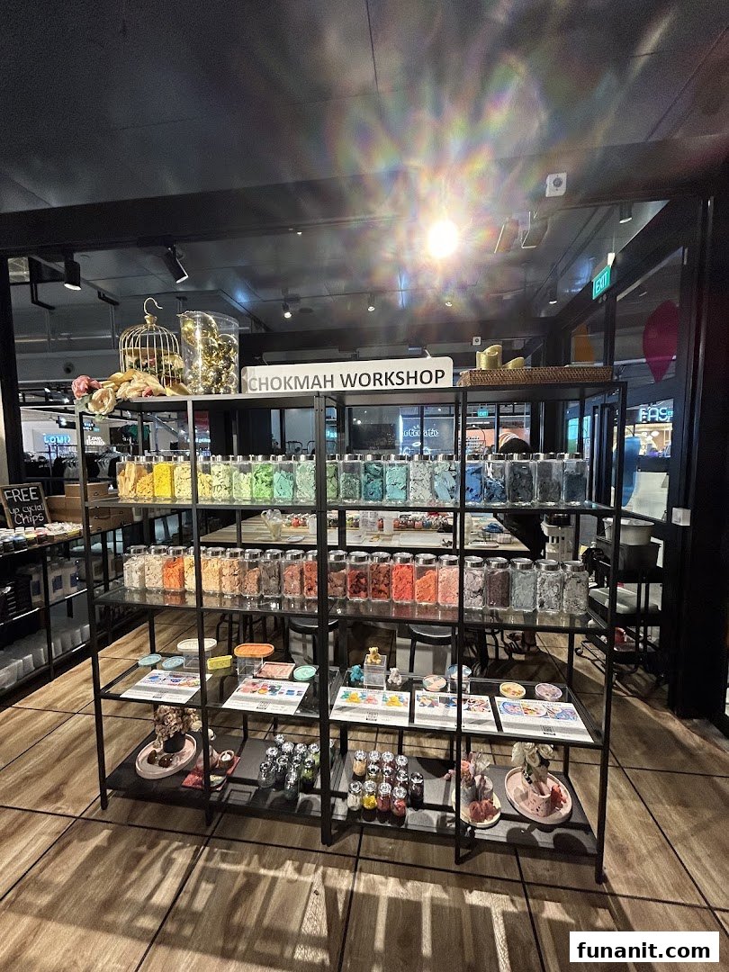Interior view of Chokmah workshop, showcasing colorful materials in jars on display shelves.