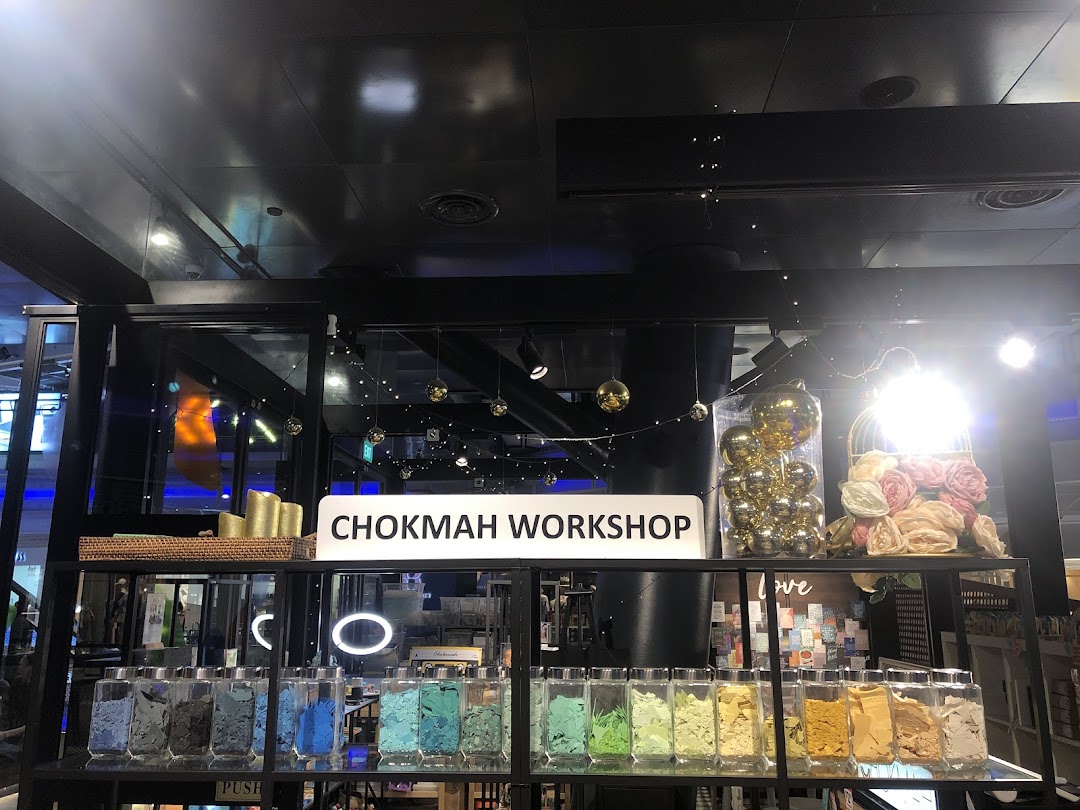 Interior view of Chokmah Workshop, showcasing colorful craft materials in jars and decorative displays.