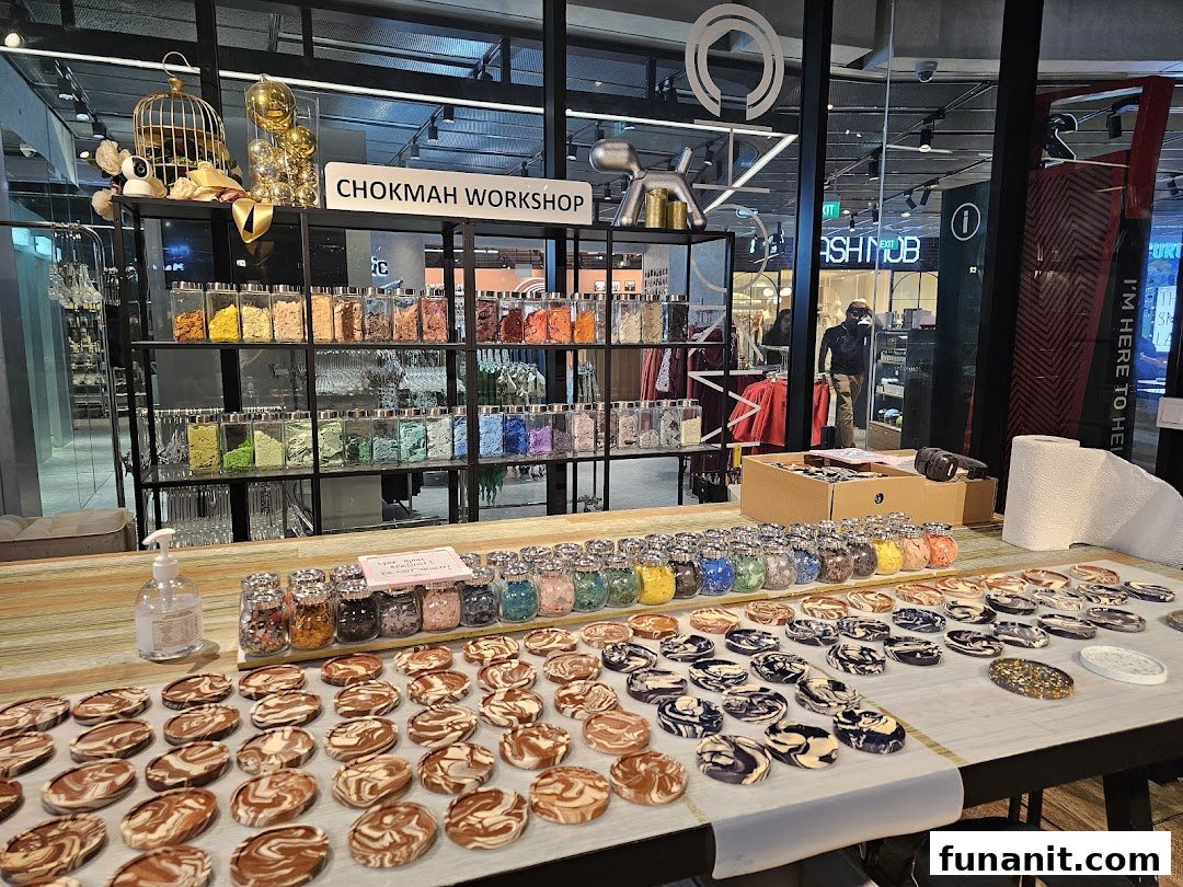 A Chokmah Workshop display featuring colorful materials in jars and numerous marbled craft items.