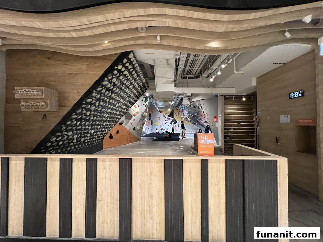 An interior view of Climb Central Funan, showcasing bouldering walls and climbing facilities.