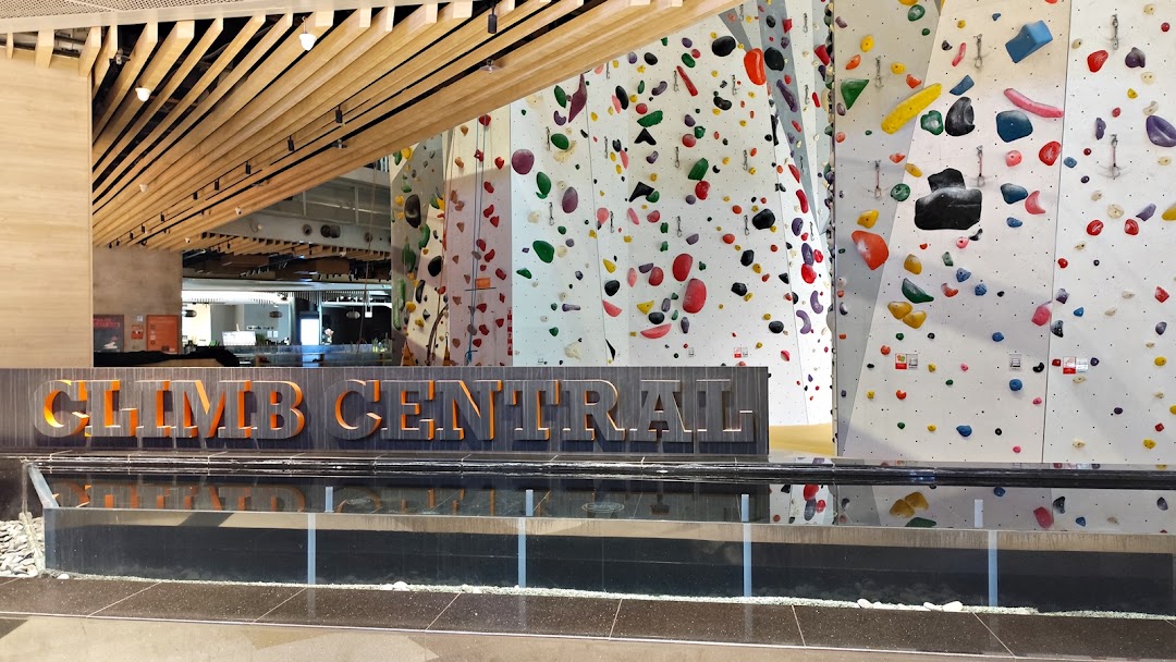 The entrance of Climb Central Funan, featuring its prominent sign and vibrant climbing walls.