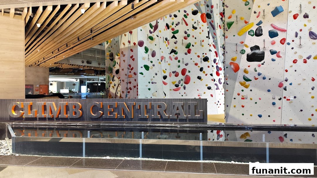 The entrance of Climb Central Funan, featuring its prominent sign and vibrant climbing walls.
