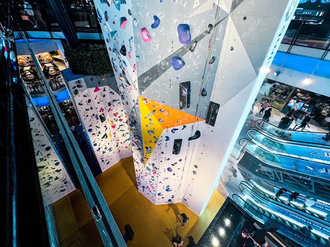 Dynamic view of Climb Central Funan's vibrant indoor climbing walls and bouldering areas within a mall setting.