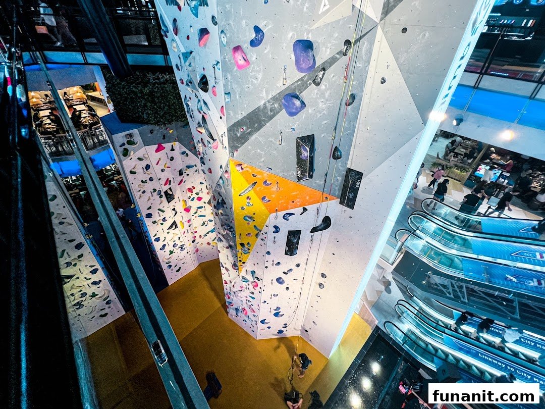 Dynamic view of Climb Central Funan's vibrant indoor climbing walls and bouldering areas within a mall setting.