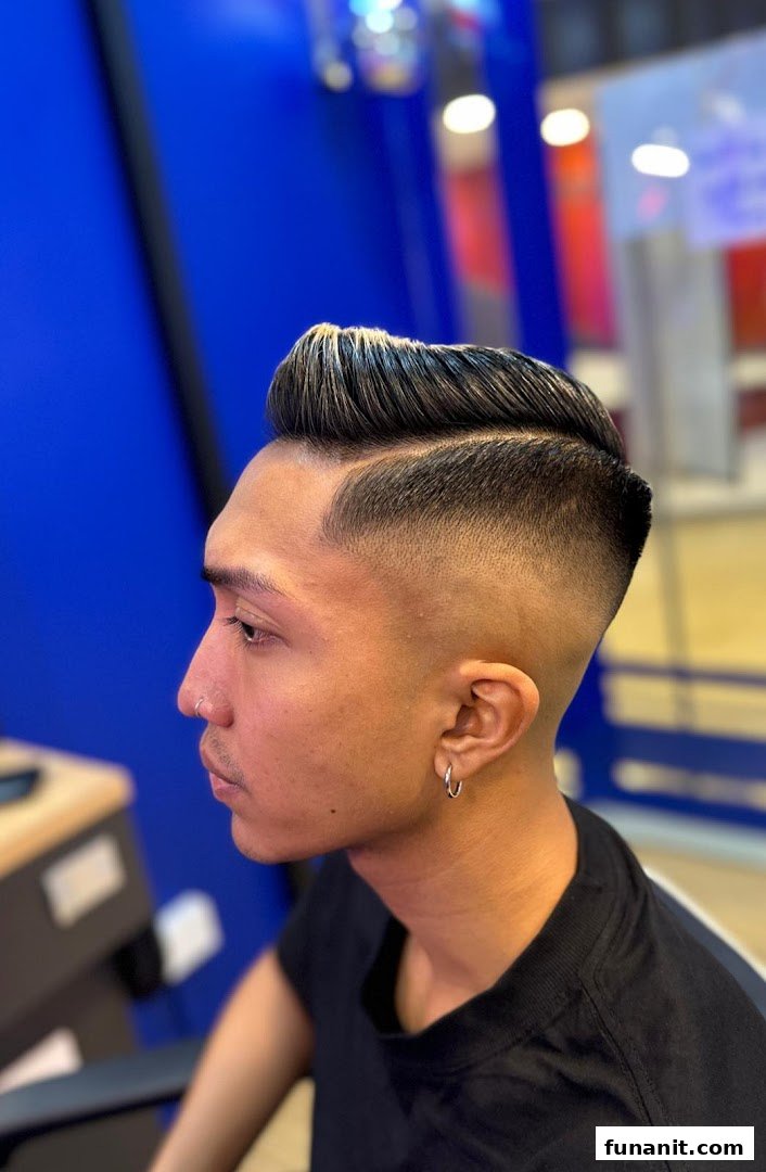 A man showcasing a fresh, stylish haircut with a modern fade and pompadour.