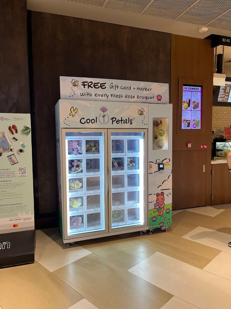 A Cool Petals flower vending machine offering fresh rose bouquets with a free gift card.
