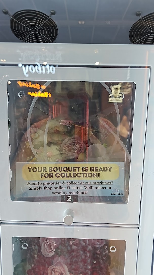 A 'Cool Petals' flower vending machine displaying a beautiful bouquet ready for collection.